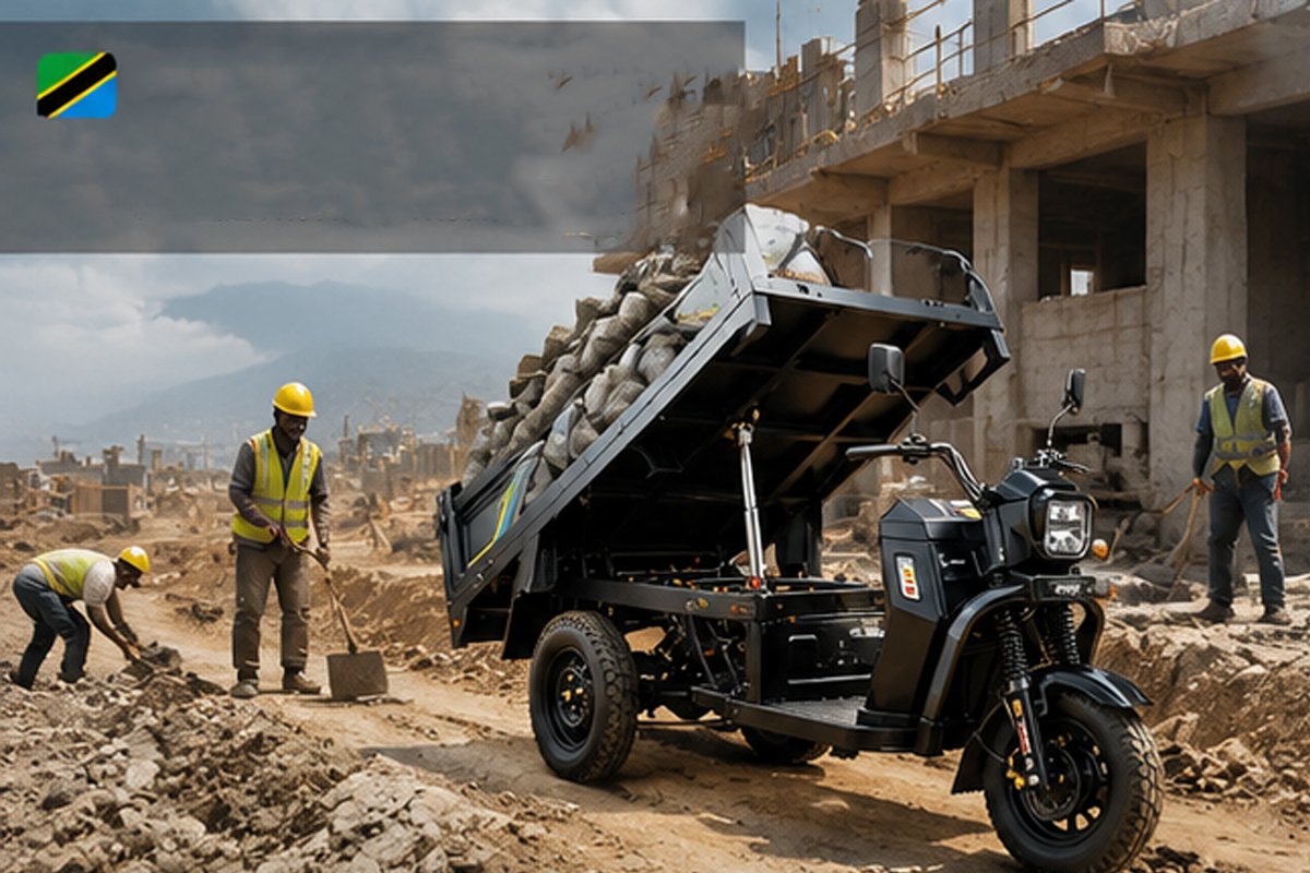 QIDI Land Cruiser HR-1 heavy-duty electric tricycle hauling construction materials on unpaved rural road in Tanzania Africa, built for rough terrain and heavy loads