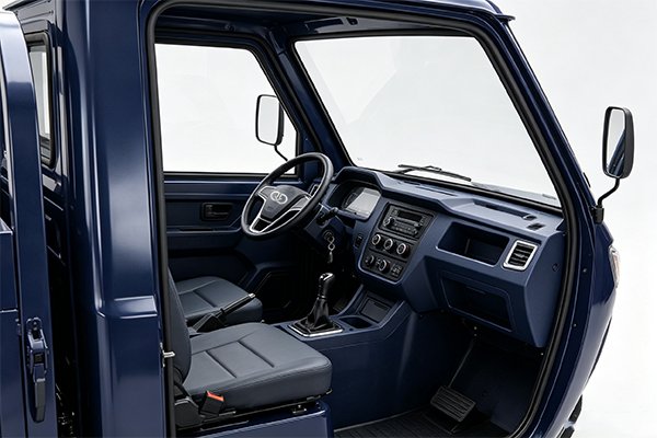 Interior of QIDI Thunder semi-enclosed electric tricycle cabin showing ergonomic seat, clear windshield and control panel for farm operations